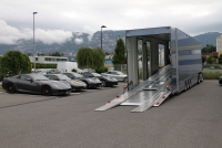 Luxury car transportation by truck